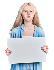 Young caucasian woman holding blank empty banner puffing cheeks with funny face. mouth inflated with air, catching air.