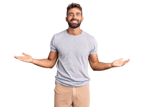 Young hispanic man wearing casual clothes smiling showing both hands open palms, presenting and advertising comparison and balance
