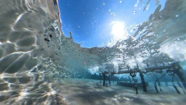 Slow Motion Underwater View Of Fountain On Sunny Day
