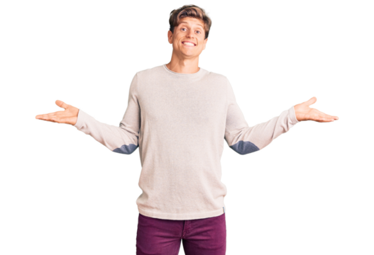 Young handsome man wearing casual clothes clueless and confused expression with arms and hands raised. doubt concept.