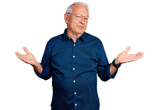 Senior man with grey hair wearing casual shirt and glasses clueless and confused expression with arms and hands raised. doubt concept.