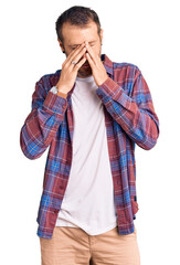 Young handsome man wearing casual clothes rubbing eyes for fatigue and headache, sleepy and tired expression. vision problem