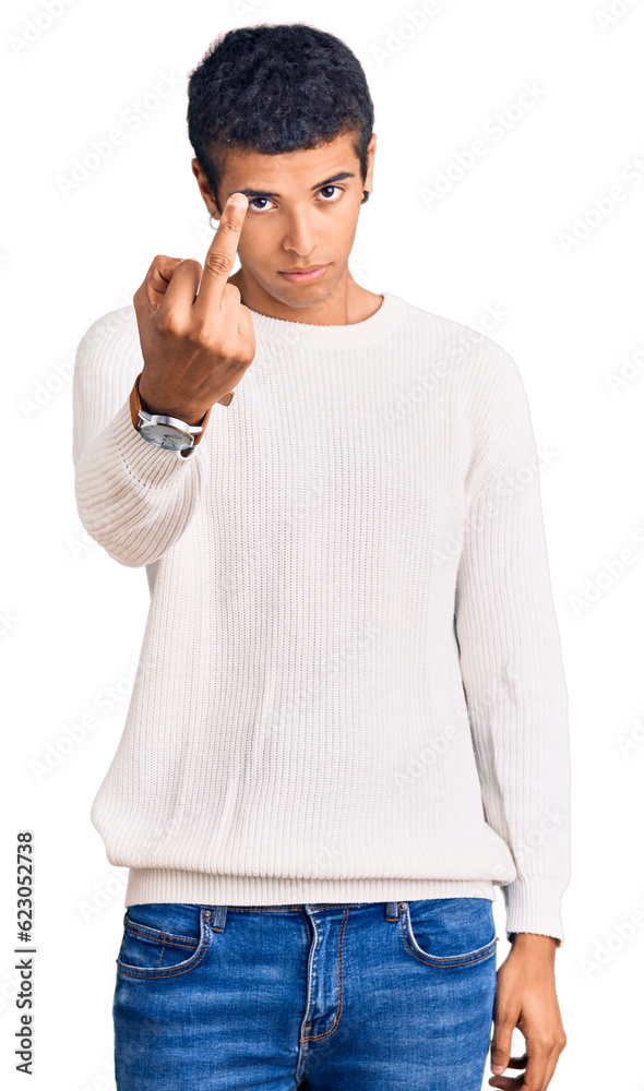 Wall mural Young african amercian man wearing casual clothes showing middle finger, impolite and rude fuck off expression