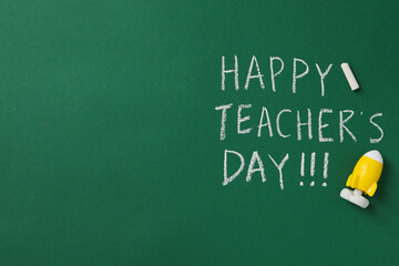 Happy teacher's day greetings, inscription on a green board