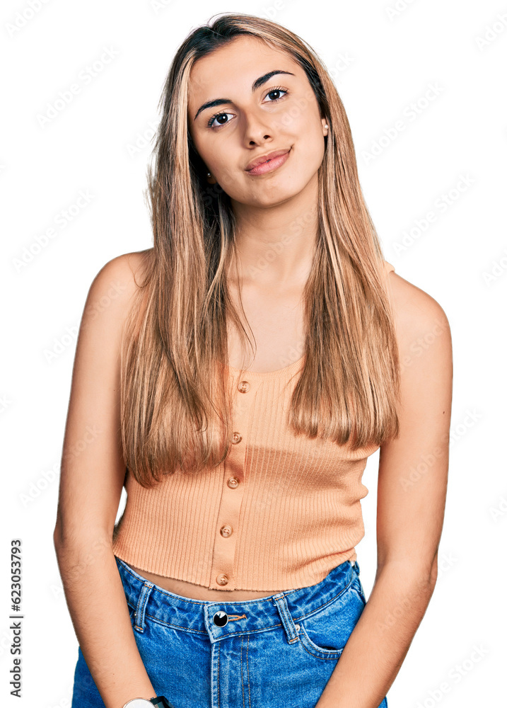 Wall mural hispanic young woman wearing casual summer shirt relaxed with serious expression on face. simple and