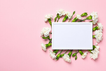 Photo frame with flowers on a pink background