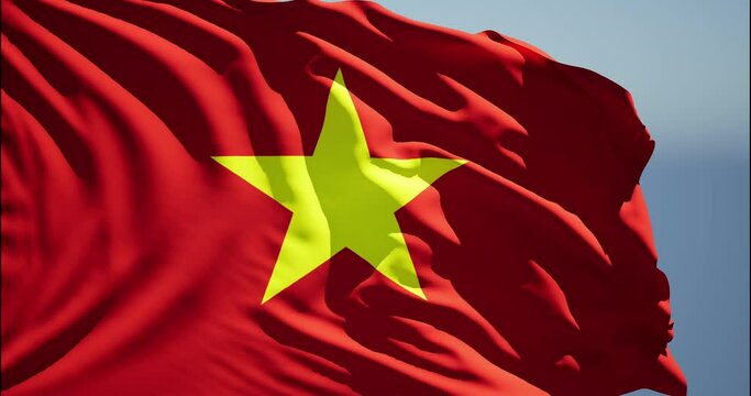 Close-up of the national flag of Vietnam flutters in the wind on a sunny day , 4k slow motion