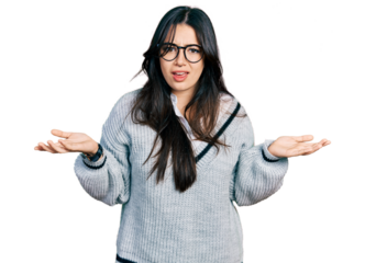 Beautiful hispanic woman wearing casual sweater and glasses clueless and confused with open arms, no idea concept.