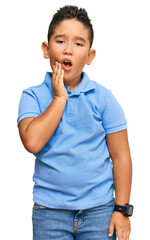 Little boy hispanic kid wearing casual clothes touching mouth with hand with painful expression because of toothache or dental illness on teeth. dentist