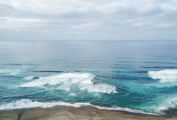 Aerial view of the beach with waves in the Atlantic ocean. Ribeira Grande São Miguel Island in the Azores.