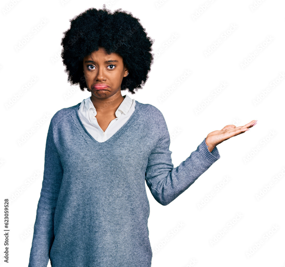 Canvas Prints Young african american woman presenting with open palm depressed and worry for distress, crying angry and afraid. sad expression.