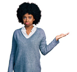 Young african american woman presenting with open palm depressed and worry for distress, crying angry and afraid. sad expression.
