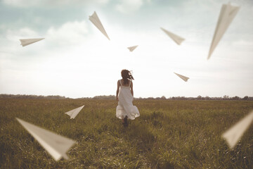surreal flying of paper airplanes surrounding a woman running in the outdoors