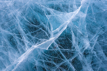 Amazing ice crack texture background, Close-up texture surface cracks of the natural ice in frozen water at Baikal lake, Russia. - Powered by Adobe