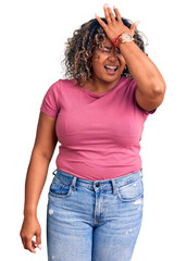 Young african american plus size woman wearing casual clothes surprised with hand on head for mistake, remember error. forgot, bad memory concept.