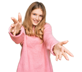 Beautiful young caucasian girl wearing casual winter sweater looking at the camera smiling with open arms for hug. cheerful expression embracing happiness.