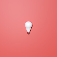 White Lightbulb With Red Background