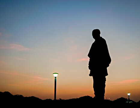 Kevadia, Gujrat,India-March 28th,2023:  Silhouette image of Worlds tallest statue known as Statue of unity with beautiful sunset sky background in Kevadia, India.