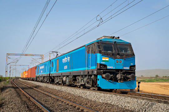 Virar, Maharashtra, India-May 17th, 2022: India's most powerful locomotive hauling colorful container train.
