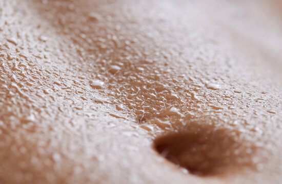 procedure removing cellulite on female abdomen, cavitation belly massage. Ultrasonic massage for weight loss. Correction of female figure without surgical intervention. Closeup of the tummy.