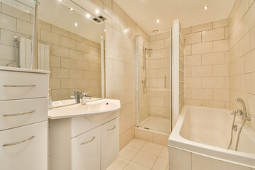 a bathroom with a tub, sink and bathtub in it's corner area next to the shower stall