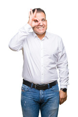 Fototapeta premium Middle age arab elegant man over isolated background doing ok gesture with hand smiling, eye looking through fingers with happy face.