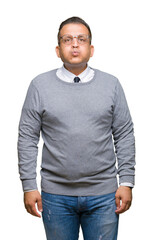 Fototapeta premium Middle age bussines arab man wearing glasses over isolated background puffing cheeks with funny face. Mouth inflated with air, crazy expression.