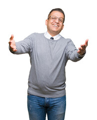 Naklejka premium Middle age bussines arab man wearing glasses over isolated background looking at the camera smiling with open arms for hug. Cheerful expression embracing happiness.