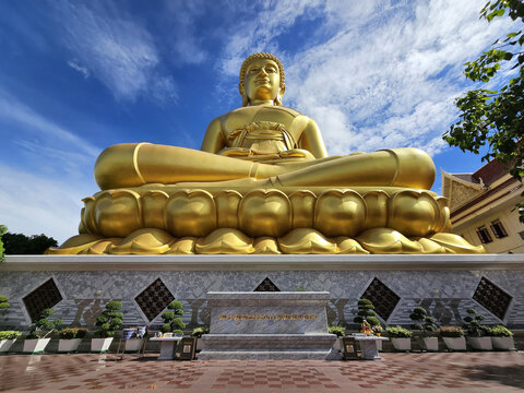 BANGKOK, THAILAND - JULY 10, 2023: Huge Golden Buddha Image at Wat Paknam Phra Sri Charoen Temple where is a Famous Landmark of Bangkok, Thailand.