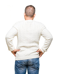 Middle age arab man wearing glasses over isolated background standing backwards looking away with arms on body