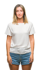 Fototapeta premium Young beautiful woman over isolated background with serious expression on face. Simple and natural looking at the camera.