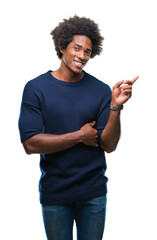 Afro american man over isolated background with a big smile on face, pointing with hand and finger to the side looking at the camera.