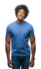 Afro american man over isolated background smiling looking side and staring away thinking.