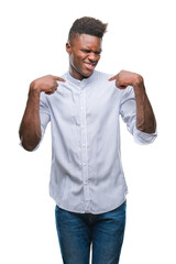 Young african american man over isolated background looking confident with smile on face, pointing oneself with fingers proud and happy.