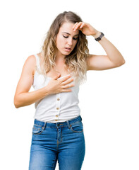 Fototapeta premium Beautiful young blonde woman over isolated background Touching forehead for illness and fever, flu and cold, virus sick