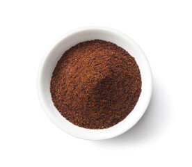 Ground roasted coffee beans in white bowl isolate on white background. Clipping path.