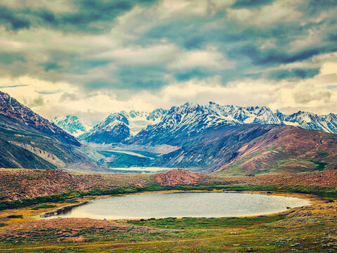 Vintage retro effect filtered hipster style image of small mountain lake in Himalayas. Spiti valley, Himachal Pradesh, India