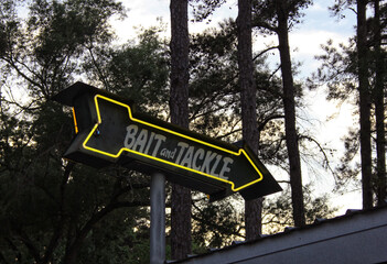 Vintage Neon Bait and Tackle Sign in Rural Area near Lake