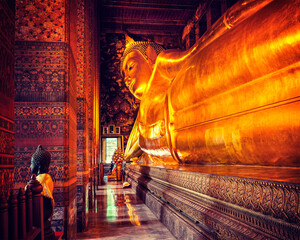 Vintage retro effect filtered hipster style image of reclining Buddha gold statue. Wat Pho, Bangkok, Thailand - 623089730