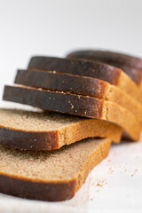 Slices of black bread. On a white background