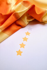 Five star rating. Graphic yellow stars print on paper. Rating of the services provided, quality assessment from the customer. Positive rank, public reputation. Feedback or review to business