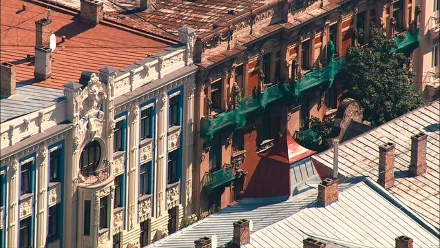 aerial wide shot of zoomed street view from above in the Riga city with art nouveau buildings
