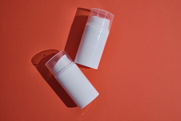 Container for cream, shampoo, toiletries, spa. Unbranded white plastic bottles. Bottle with a dispenser for cosmetic products. Skin care and beauty concept. Mockup style, copy space