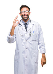 Fototapeta premium Adult hispanic doctor man over isolated background smiling positive doing ok sign with hand and fingers. Successful expression.