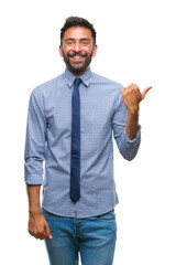 Adult hispanic business man over isolated background smiling with happy face looking and pointing to the side with thumb up.