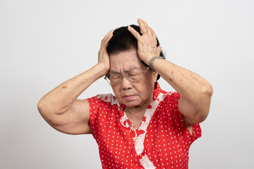 A senior woman who has a severe headache suffers from a stroke ,brain disease,patient holding head...