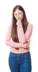 Young Chinese woman over isolated background wearing glasses looking confident at the camera with smile with crossed arms and hand raised on chin. Thinking positive.