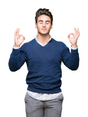 Young handsome business man over isolated background relax and smiling with eyes closed doing meditation gesture with fingers. Yoga concept.