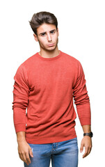 Fototapeta premium Young handsome man over isolated background depressed and worry for distress, crying angry and afraid. Sad expression.