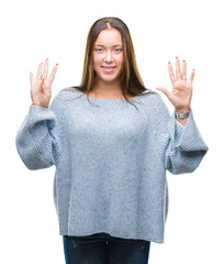 Young beautiful caucasian woman wearing winter sweater over isolated background showing and pointing up with fingers number nine while smiling confident and happy.